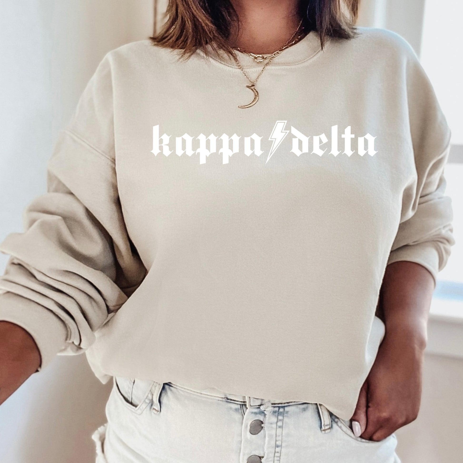 a woman wearing a white sweatshirt with the words happy berlin printed on it