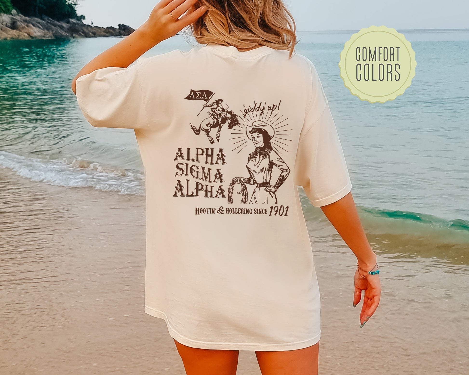 a woman standing on a beach next to the ocean