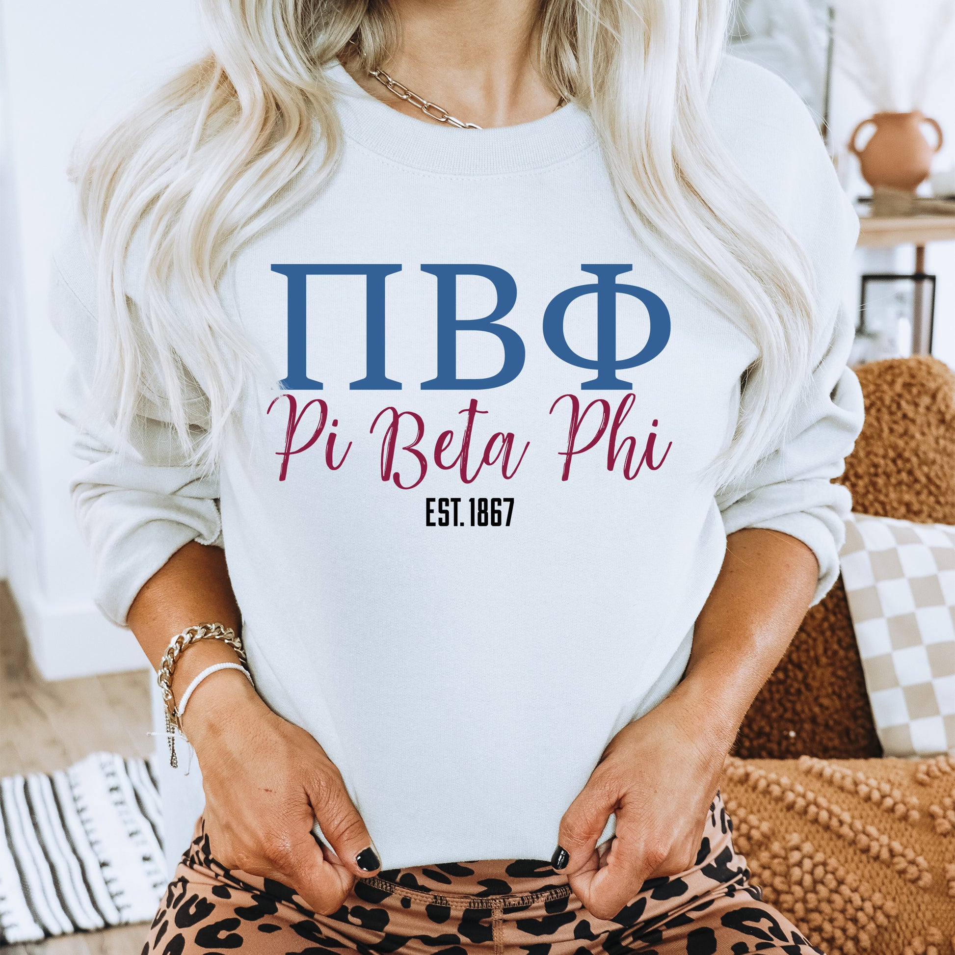 a woman wearing a white shirt that says pi bita phi