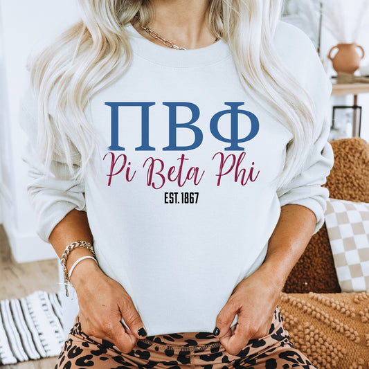 a woman wearing a white shirt that says pi bita phi