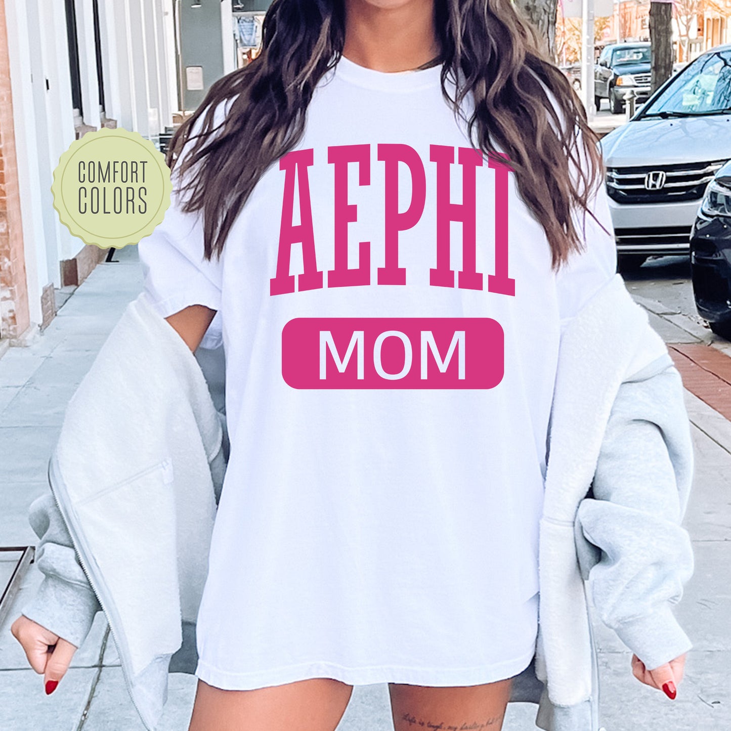a woman wearing a shirt that says aephh mom