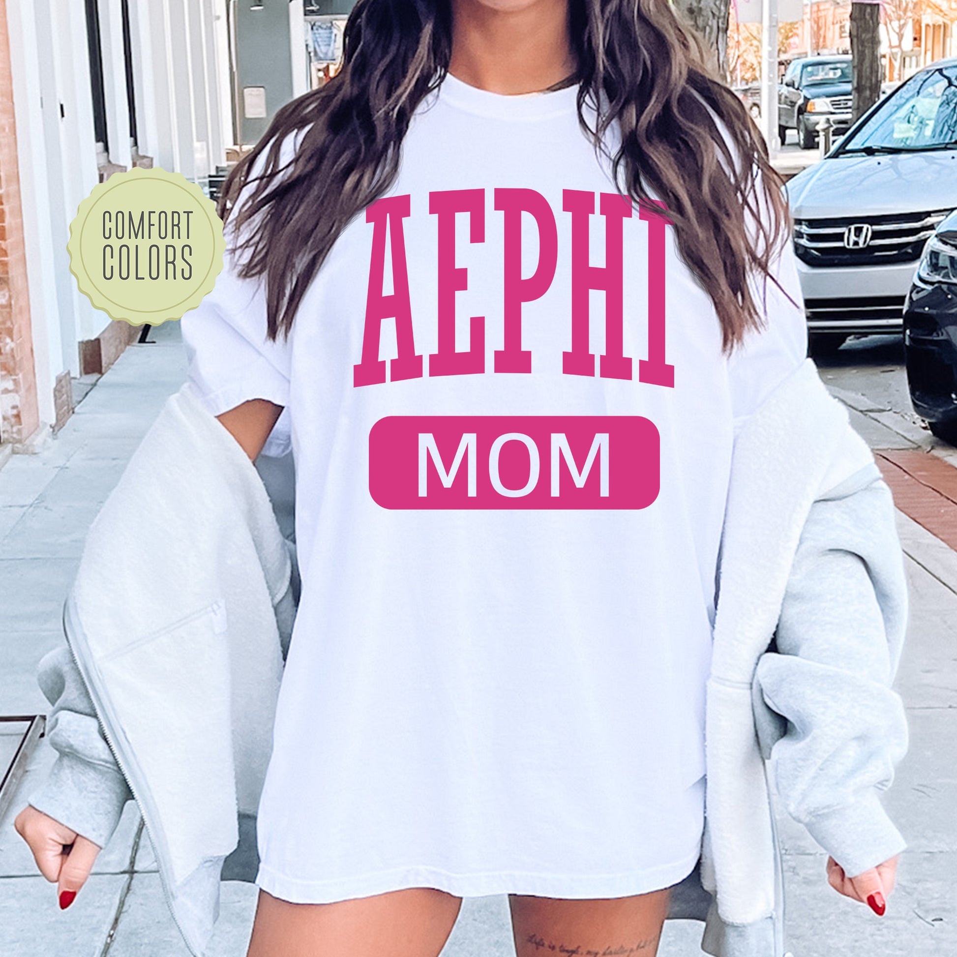 a woman wearing a shirt that says aephh mom