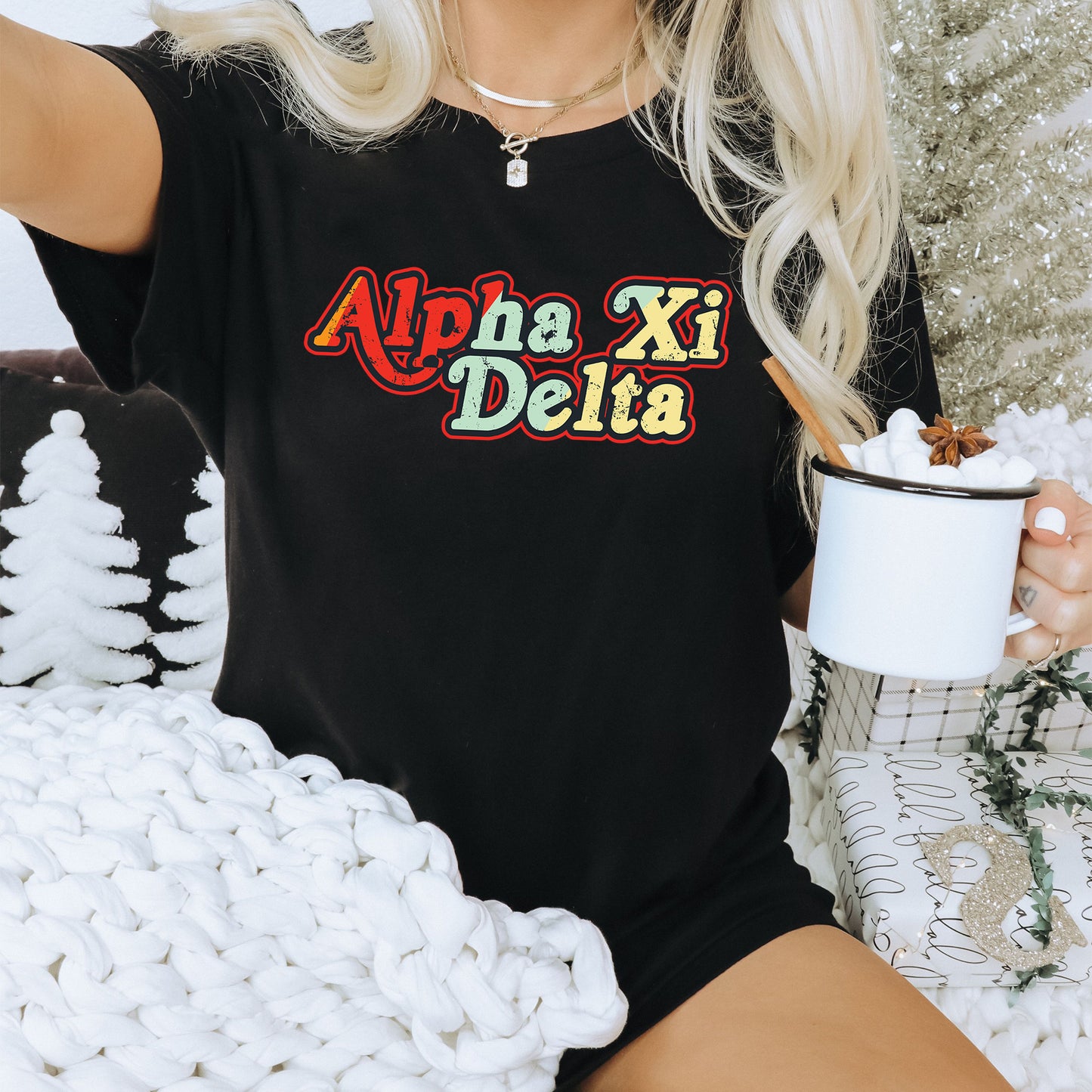 a woman sitting on a couch holding a cup of coffee