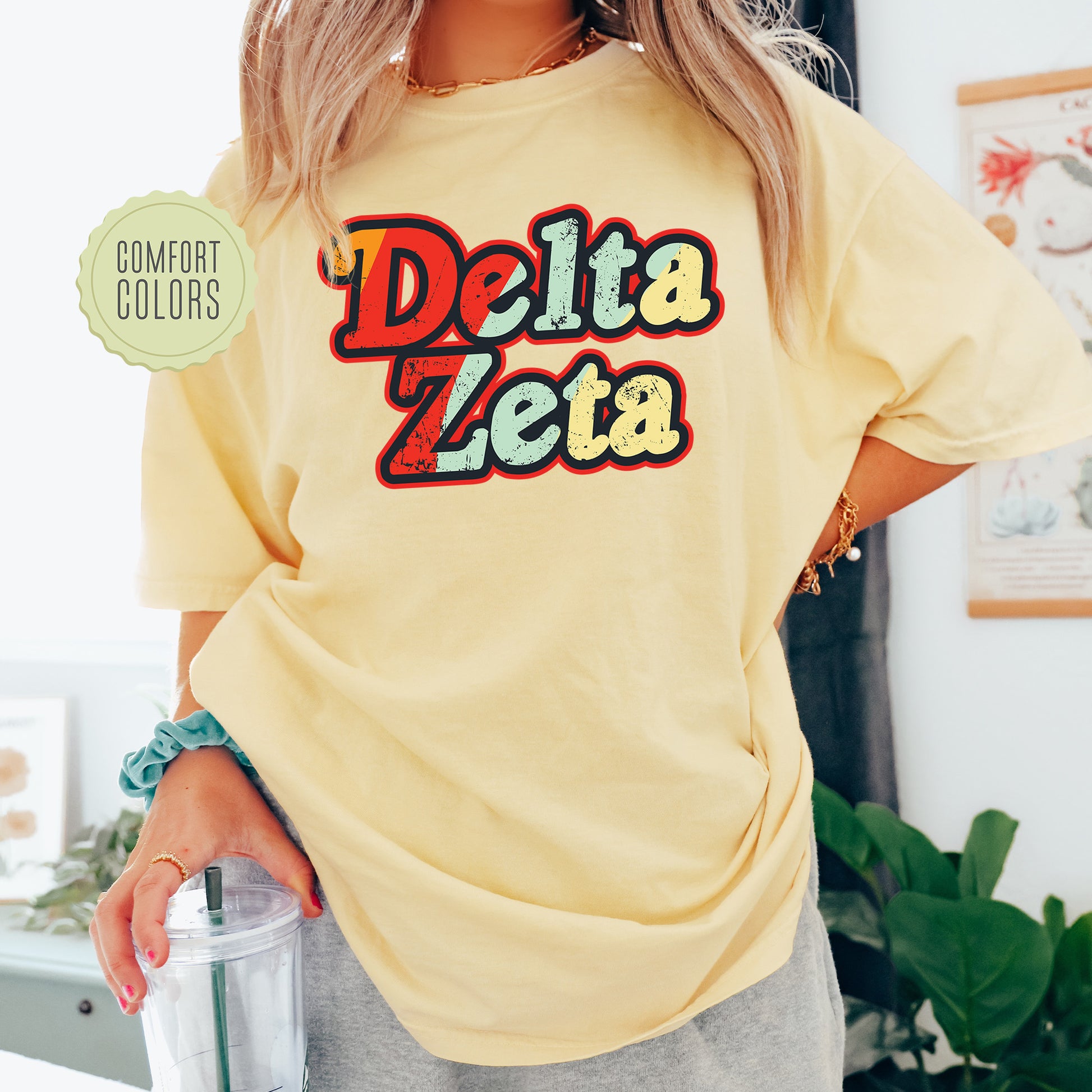 a woman wearing a yellow shirt with the word delta on it