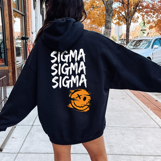a woman walking down a sidewalk with a black sweatshirt on